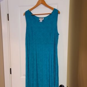 Two piece turquoise dress and jacket ensemble. Below knee length, lovely pattern